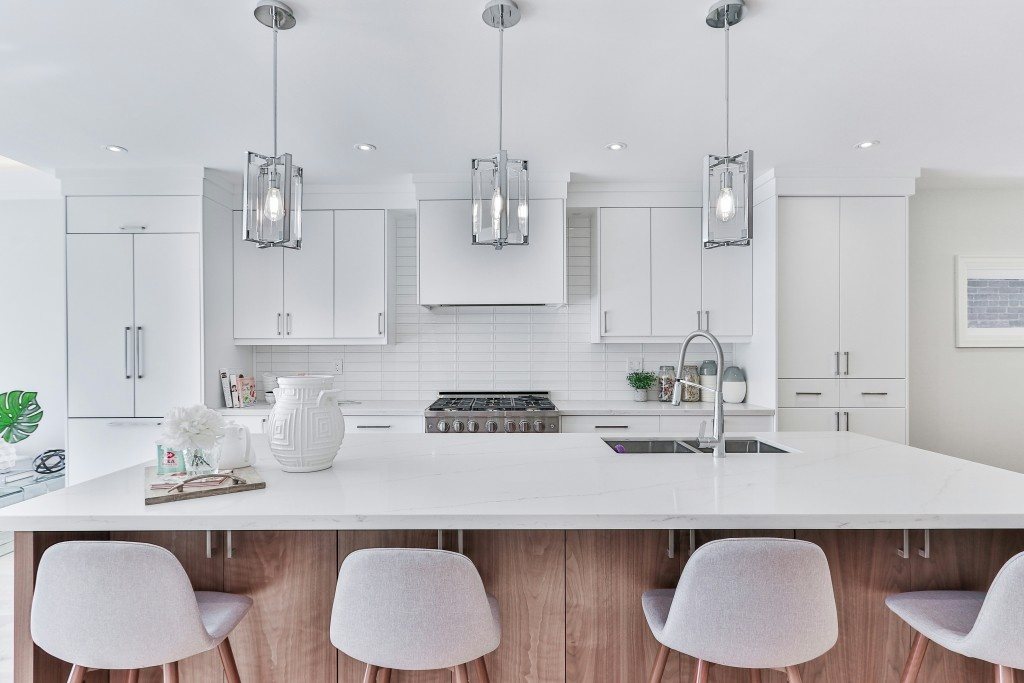 A customer's photo of their kitchen, with its existing white quartz island
